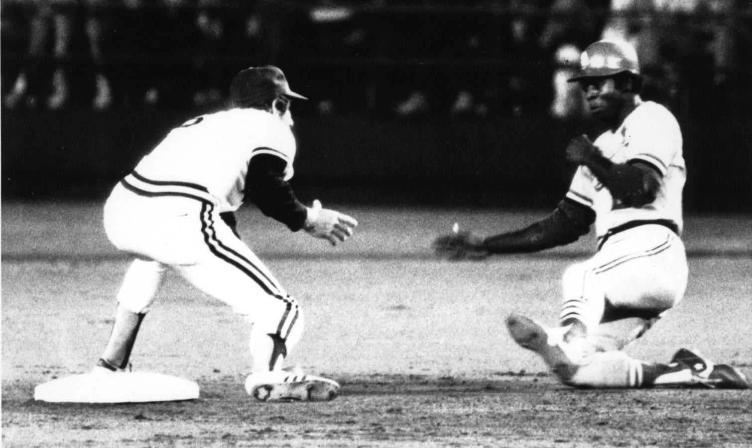 Lou Brock sliding into second base