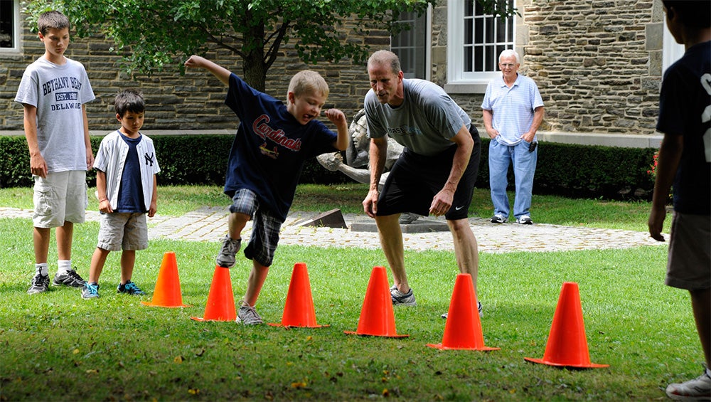 Students running an obsticle course