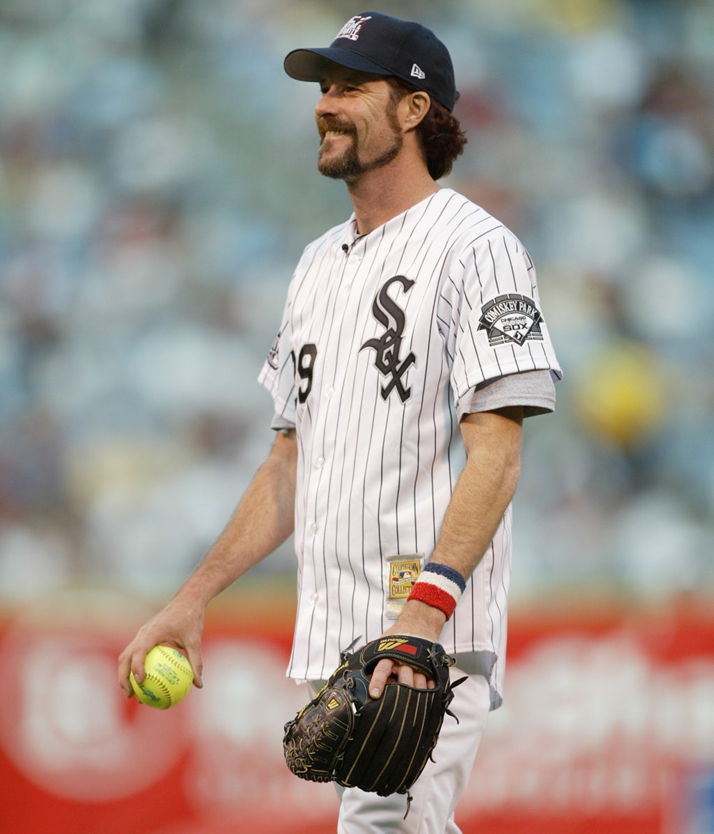 Jack McDowell in White Sox home uniform holding softball