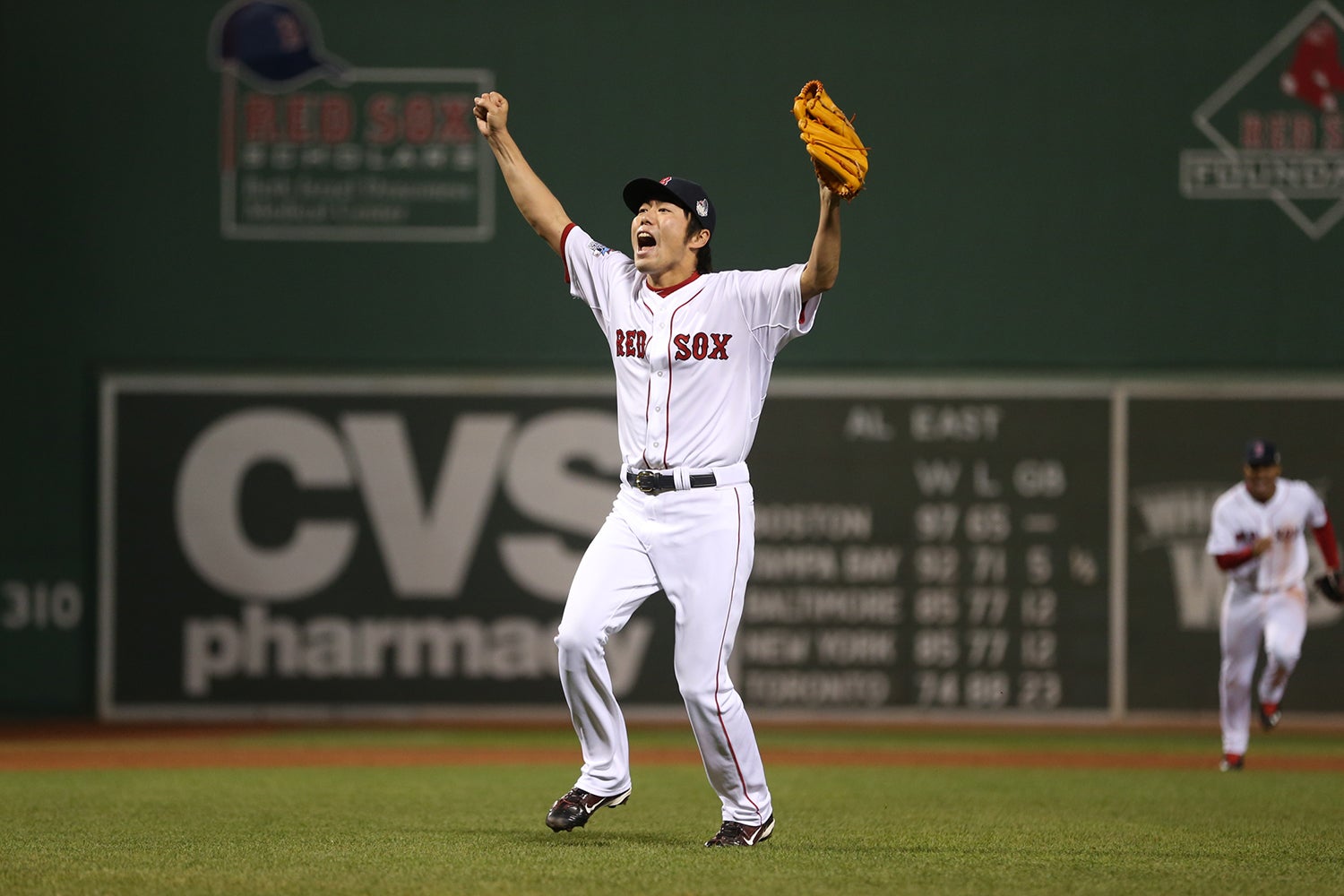 Koji Uehara raises arms after final out of 2013 World Series