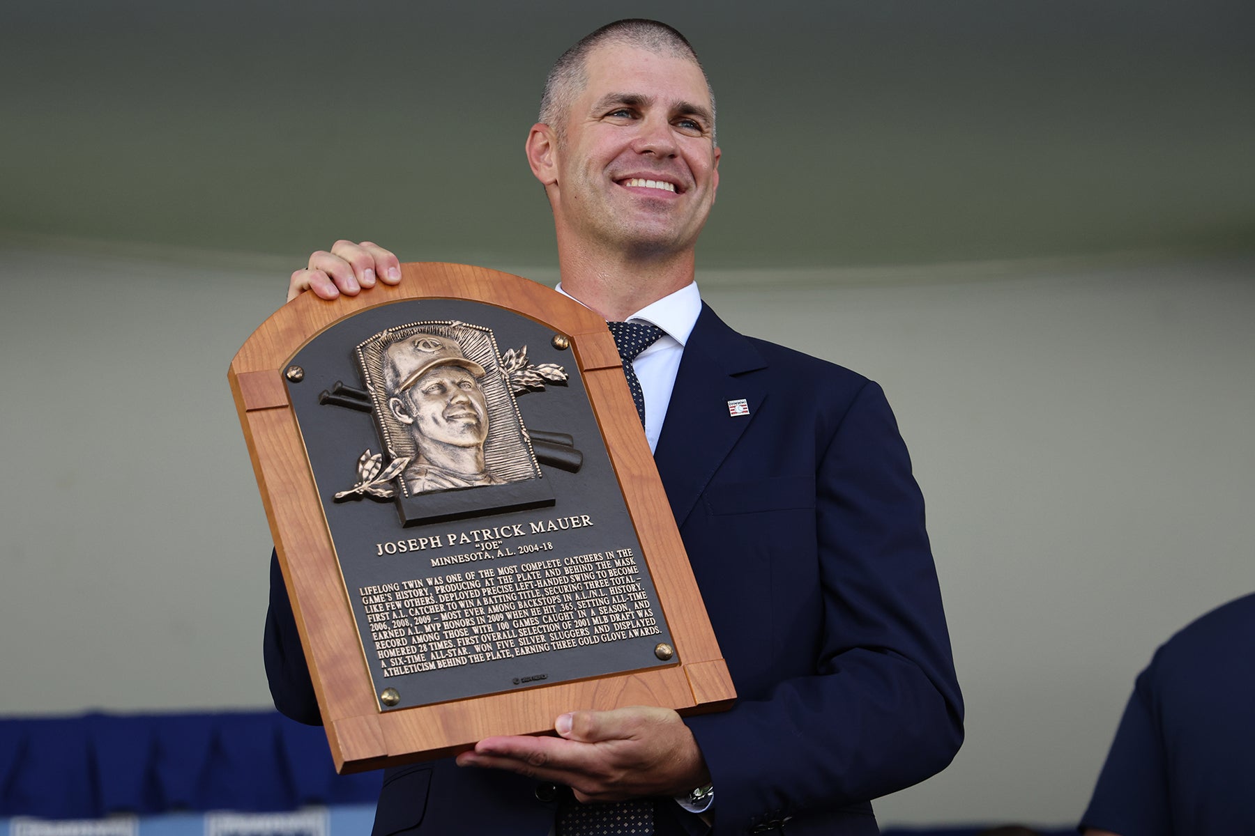 Joe Mauer holds Hall of Fame plaque