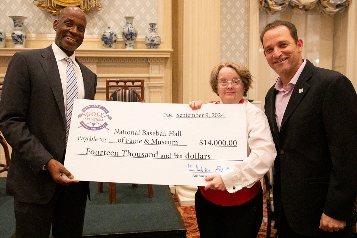 Fred McGriff and Josh Rawitch holding ceremonial check