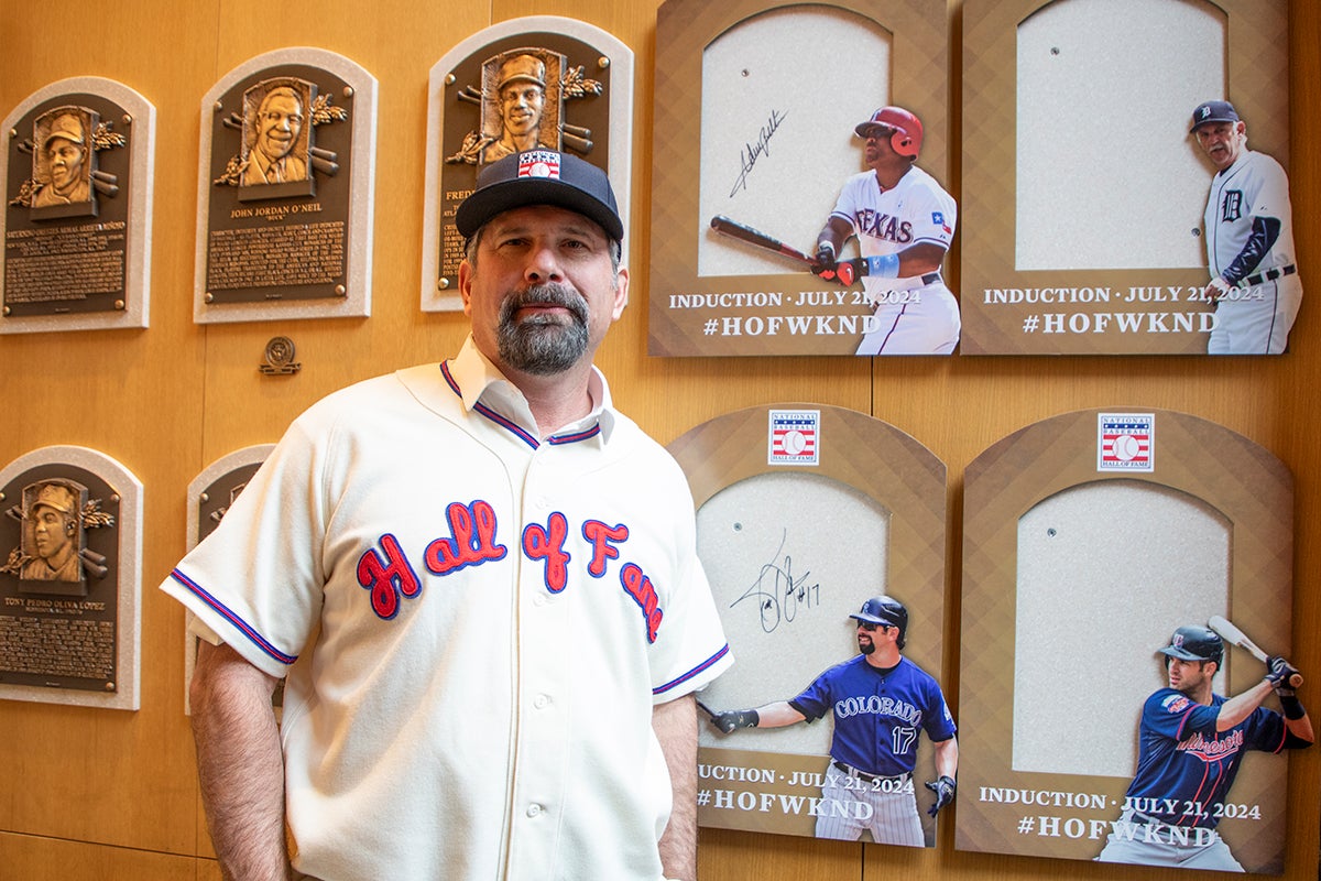 Todd Helton stands at future site of his plaque wearing Hall of Fame jersey