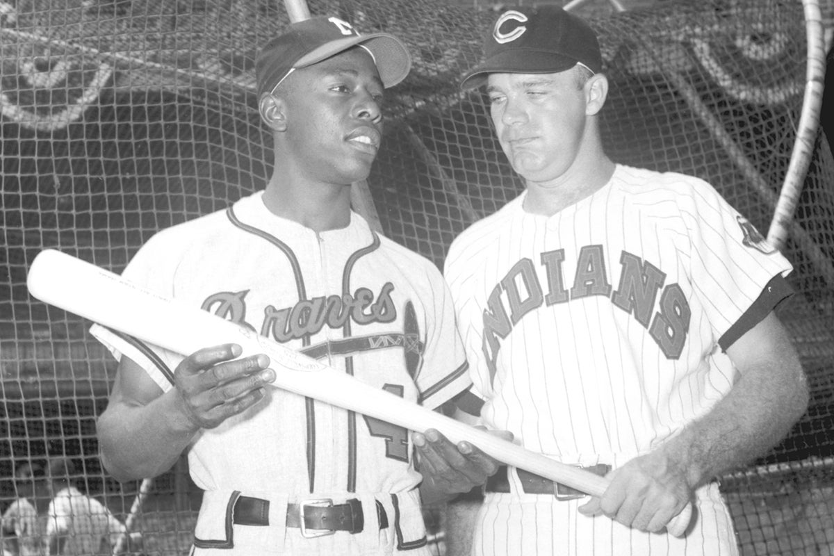 Hank Aaron and Harvey Kuenn pose with bat