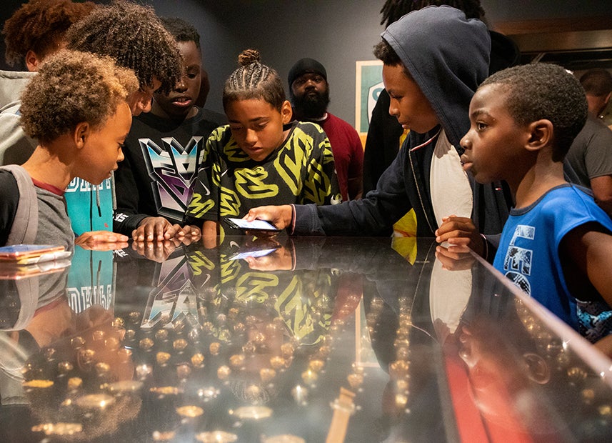 Students view the Museum's World Series ring display