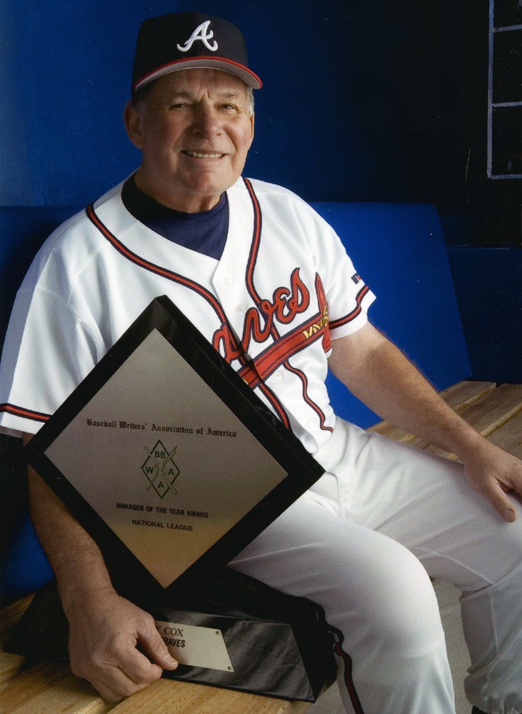 Bobby Cox poses with Manager of the Year Award