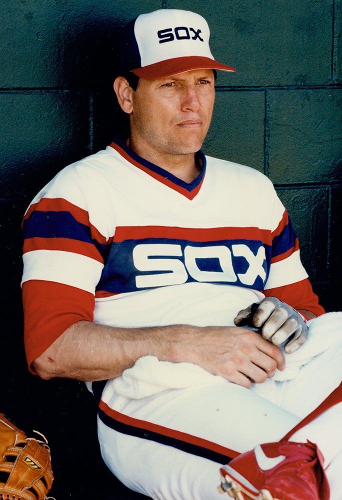 Carlton Fisk sits in dugout