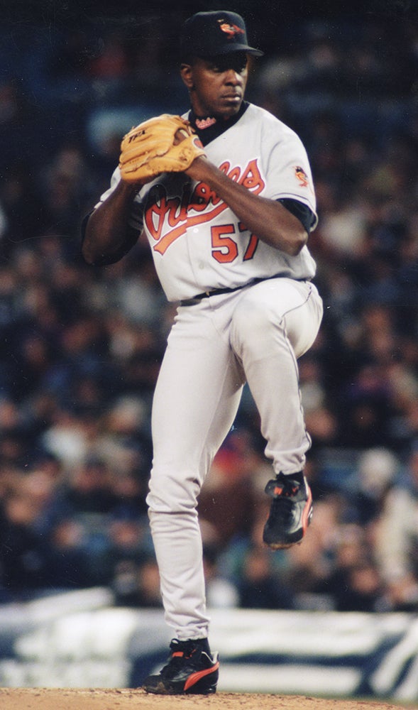 Juan Guzmán pitches for Baltimore