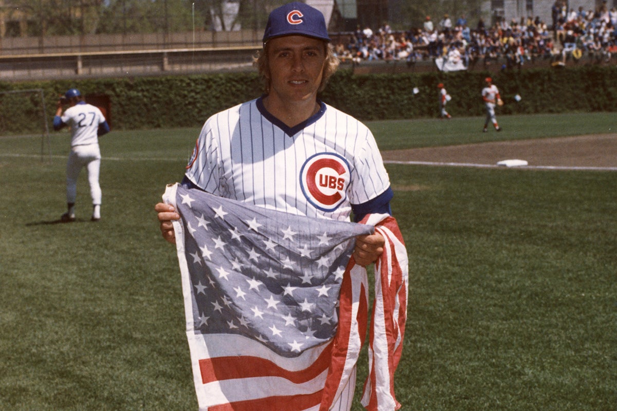 Rick Monday holding United States flag