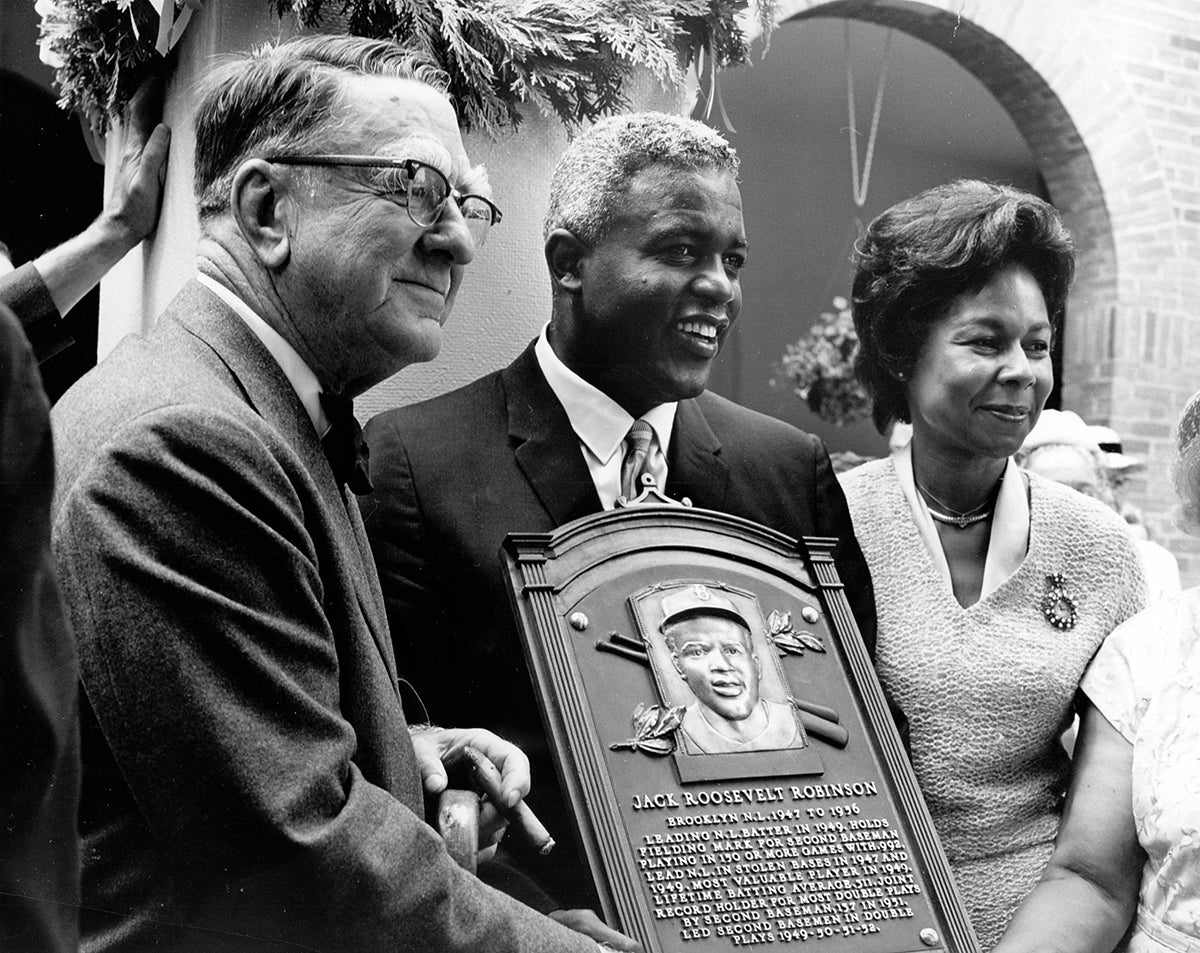 Branch Rickey, Jackie Robinson and Rachel Robinson holding Hall of Fame plaque